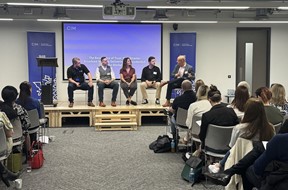 CIM North West committee chair and four panel members on stage discussing marketing